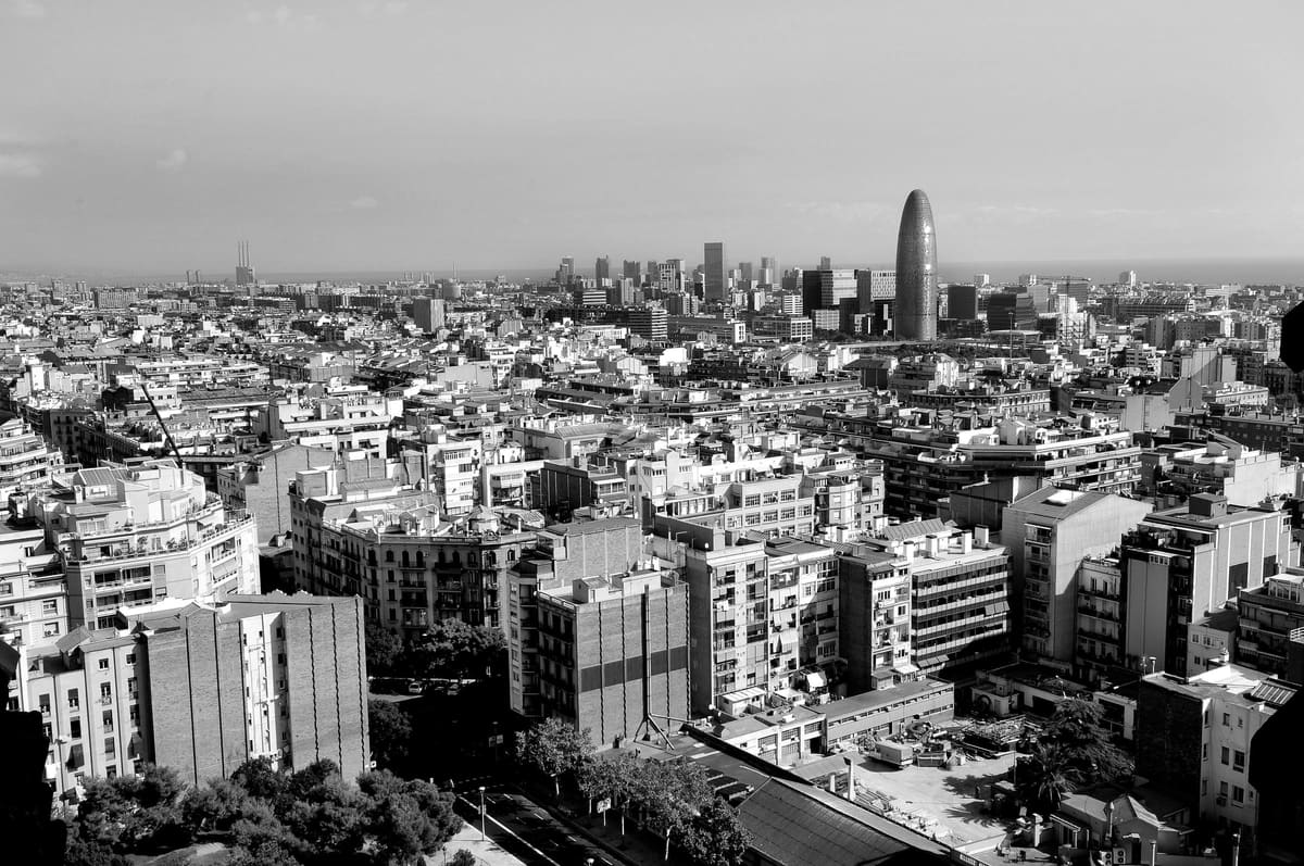 View over Barcelona with the Glòries tower and the sea in the background